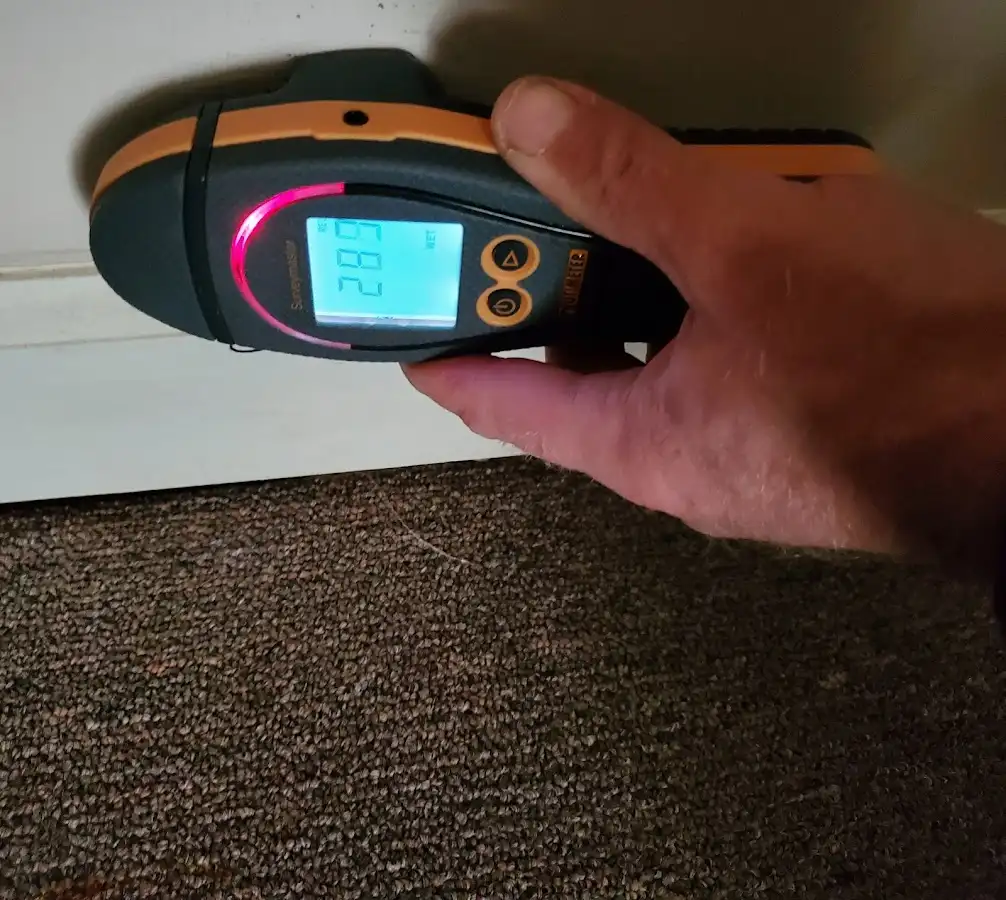 Moisture detection at baseboard during Storm Damage Restoration in Chula Vista